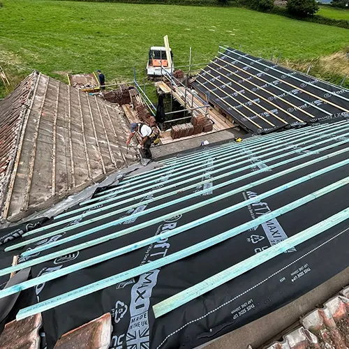 A picture of a roof being installed on a house.